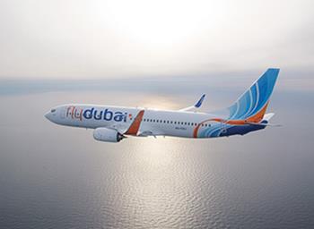 Airplane-in-the-air-over-water-410x310